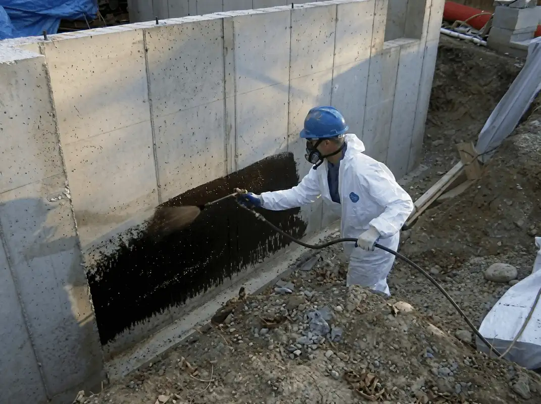 Professional waterproofing the exterior walls of the basement in Scottsdale, AZ