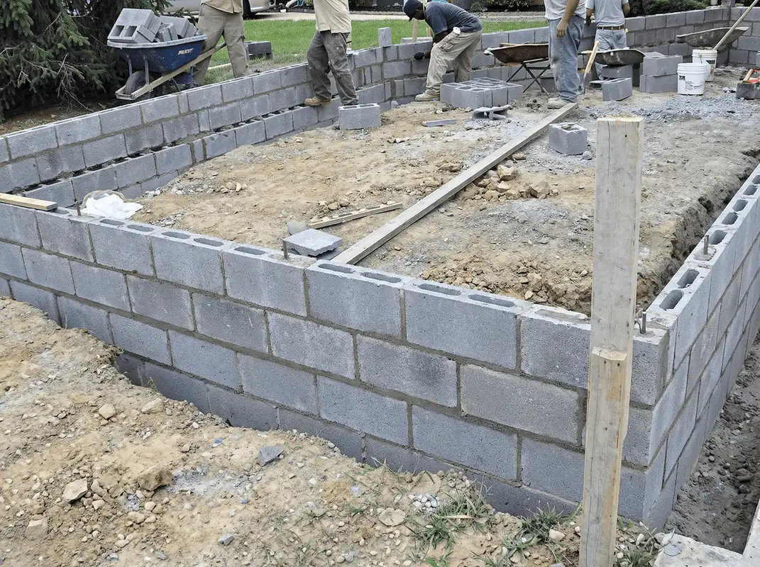 Professionals building a foundation with blocks in Scottsdale, AZ