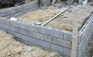 Professionals building a foundation with blocks in Scottsdale, AZ