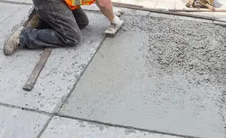 Professional repairing a concrete floor in Scottsdale, AZ