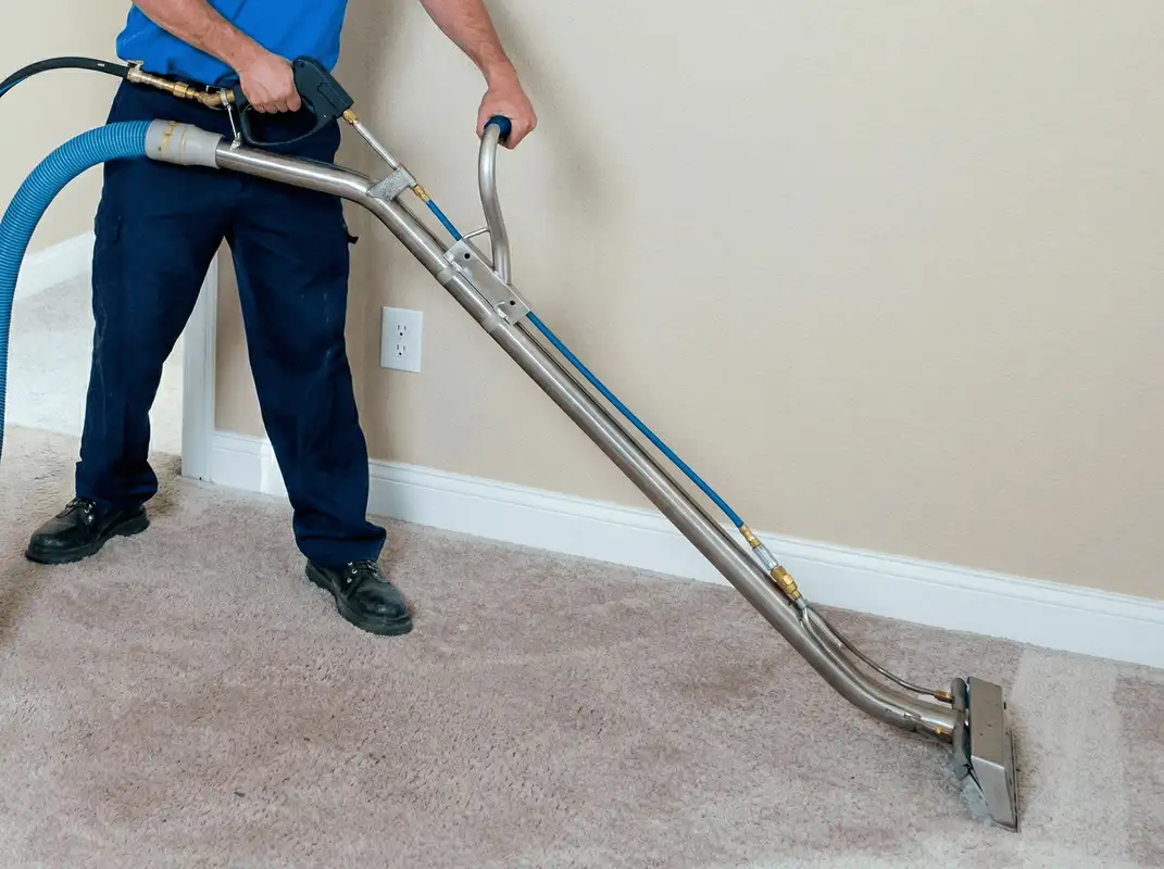 Professional operating a liquid removal machine on a carpeted floor in Scottsdale, AZ